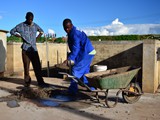 Preparing cement for the stands of the tray for the solar panels  